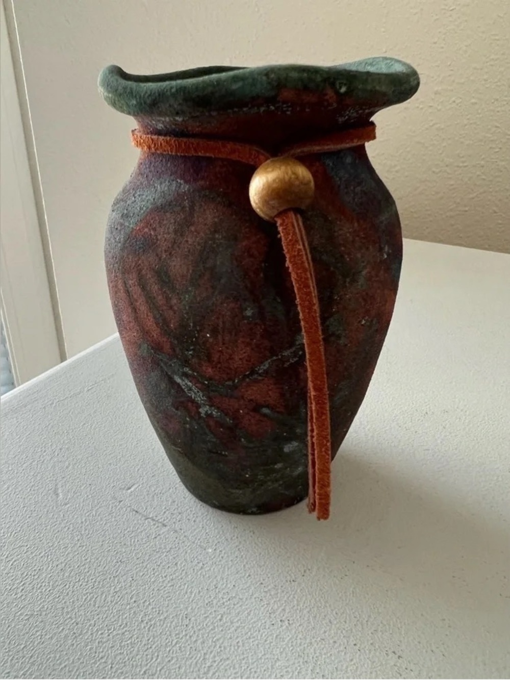 Handcrafted Green and Brown Ceramic Vase with Leather Tie - Picture 2 of 5